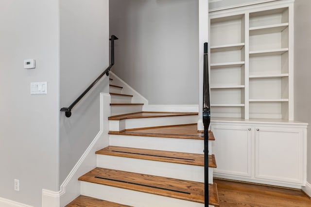 stairway with wood-type flooring