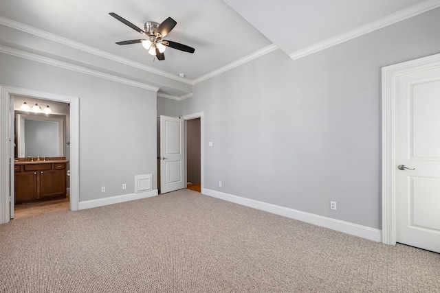 unfurnished bedroom featuring ensuite bathroom, crown molding, ceiling fan, and light colored carpet