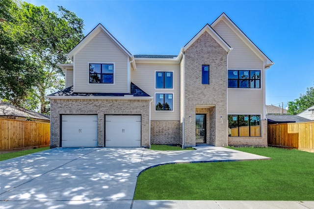 view of front facade with a front yard and a garage