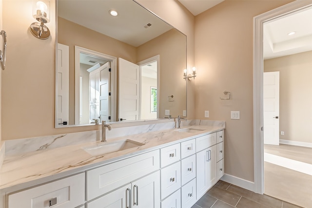 bathroom with vanity and tile patterned flooring