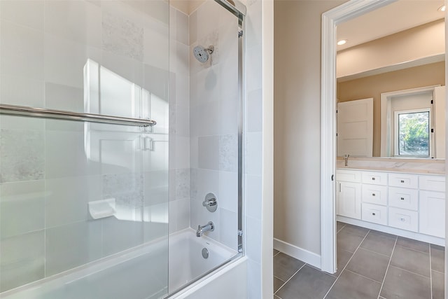 bathroom featuring vanity, tile patterned floors, and combined bath / shower with glass door