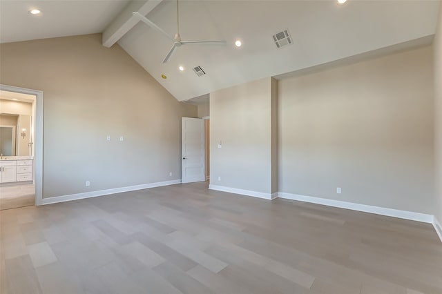 empty room featuring hardwood / wood-style flooring, beam ceiling, high vaulted ceiling, and ceiling fan