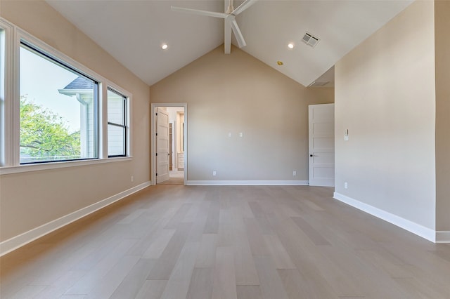 unfurnished room with high vaulted ceiling, beamed ceiling, and light hardwood / wood-style flooring