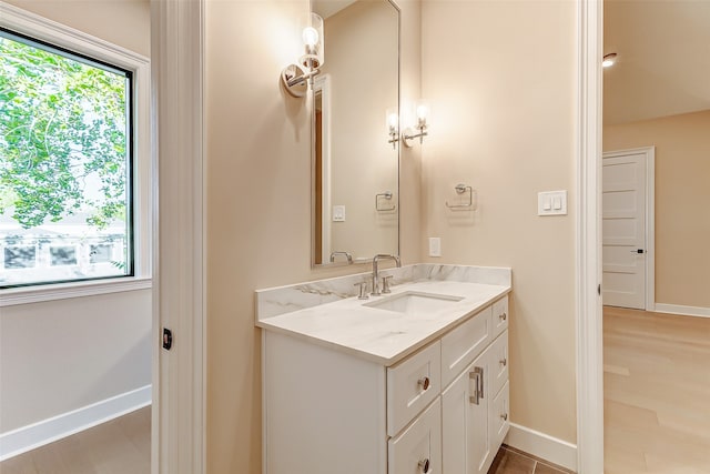 bathroom featuring vanity and hardwood / wood-style floors