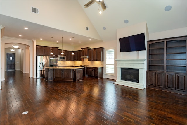 unfurnished living room with sink, dark hardwood / wood-style floors, high vaulted ceiling, and ceiling fan