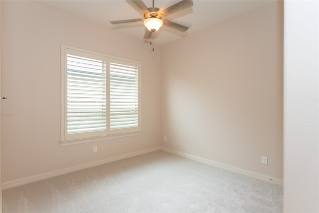 unfurnished room featuring ceiling fan and light colored carpet