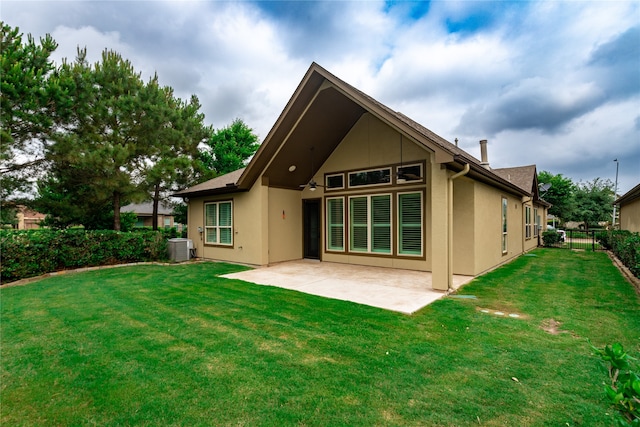 back of house featuring a patio area, central AC, and a lawn