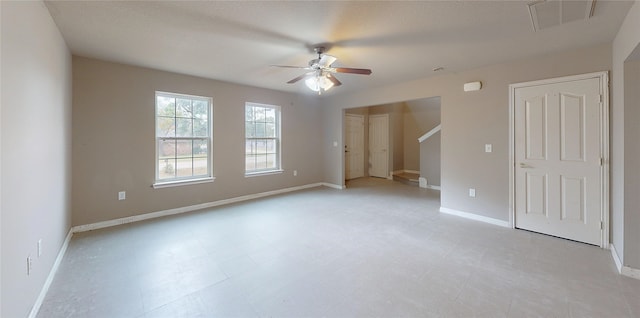 unfurnished room featuring ceiling fan