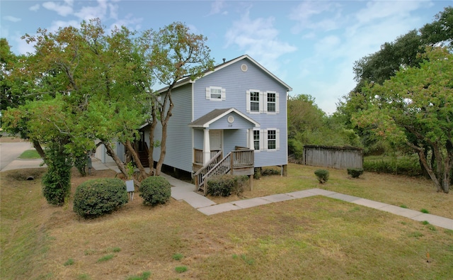 rear view of property with a yard