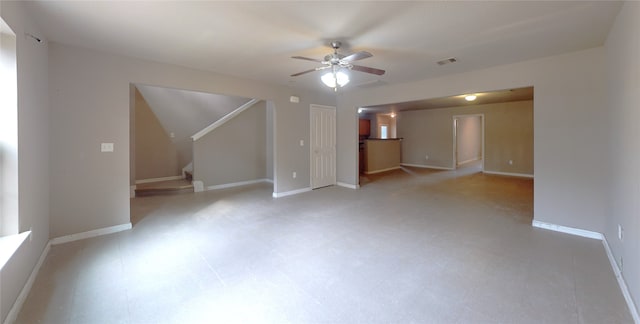 interior space featuring ceiling fan