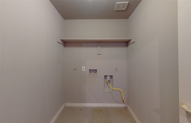 clothes washing area featuring hookup for an electric dryer, a textured ceiling, washer hookup, and light hardwood / wood-style floors