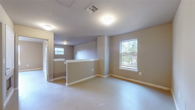 empty room featuring a textured ceiling