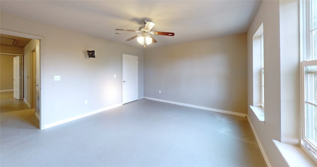 unfurnished room featuring concrete flooring and ceiling fan