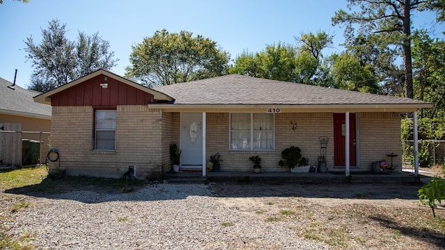 ranch-style house featuring a porch