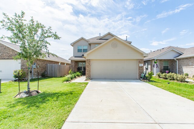 view of front facade featuring a front lawn and a garage