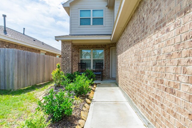 122 Austin Rd, Angleton, TX 77515 - entrance to property featuring brick siding and fence