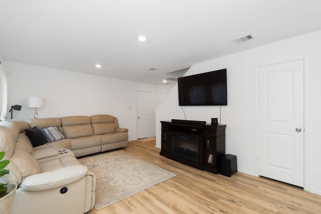 122 Austin Rd, Angleton, TX 77515 - living area with recessed lighting, light wood finished floors, and visible vents
