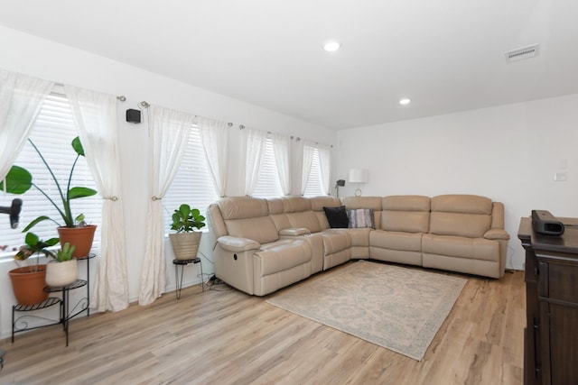 122 Austin Rd, Angleton, TX 77515 - living room featuring light wood-type flooring, visible vents, and recessed lighting