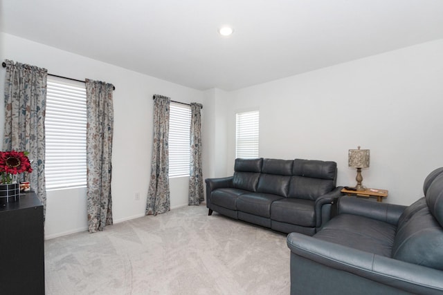 122 Austin Rd, Angleton, TX 77515 - living room with light colored carpet, baseboards, and recessed lighting