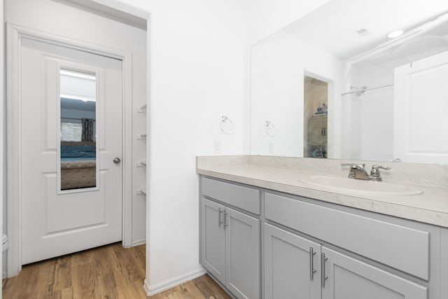 122 Austin Rd, Angleton, TX 77515 - full bathroom featuring walk in shower, wood finished floors, and vanity
