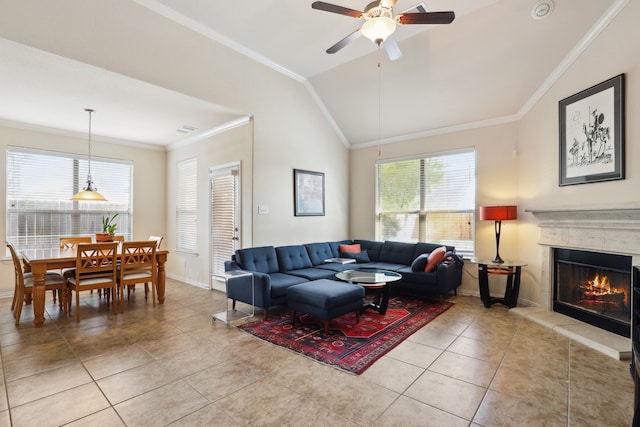 tiled living room featuring ceiling fan, lofted ceiling, and ornamental molding