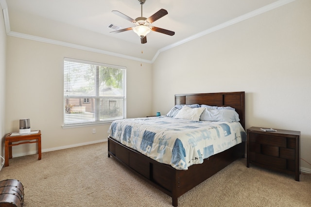 bedroom featuring ceiling fan, ornamental molding, vaulted ceiling, and light colored carpet