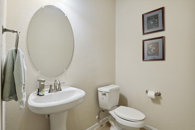 bathroom featuring sink and toilet