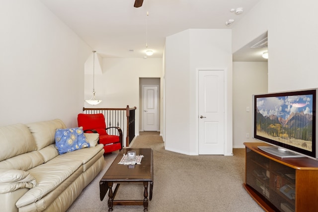 living room with carpet floors and ceiling fan