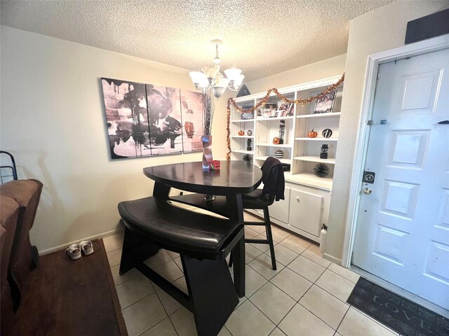 2830 S Bartell Dr Unit 39, Houston, TX 77054 - dining room with a chandelier, a textured ceiling, and light tile patterned floors