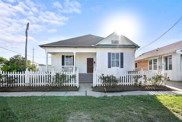 bungalow-style home featuring a front yard and a porch