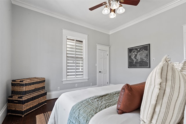 bedroom featuring crown molding, ceiling fan, and dark hardwood / wood-style flooring