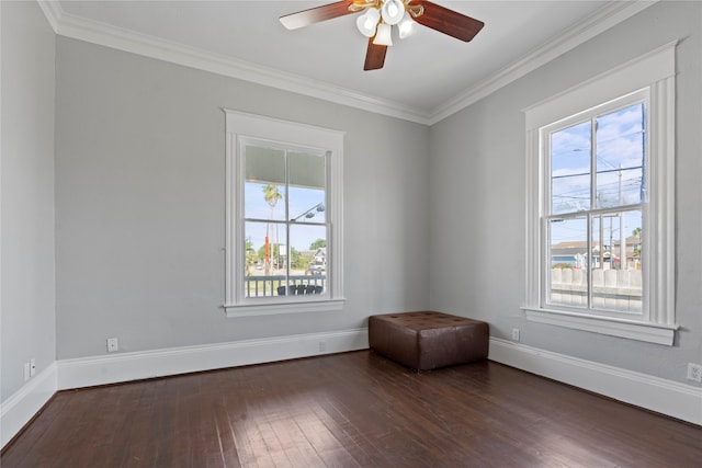 unfurnished room with ornamental molding, dark wood-type flooring, plenty of natural light, and ceiling fan