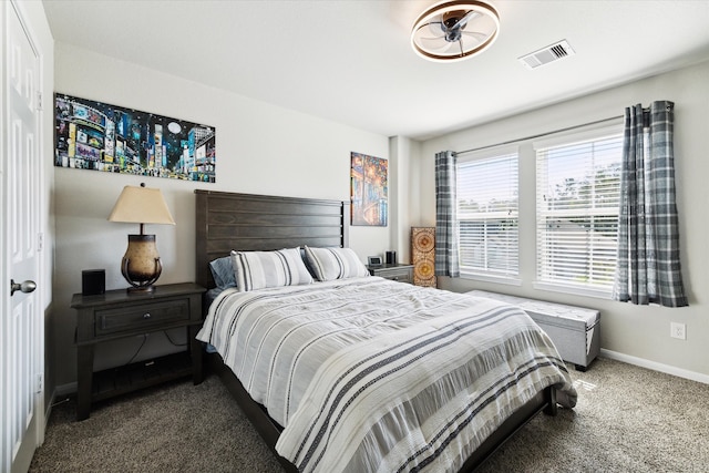 bedroom featuring dark carpet