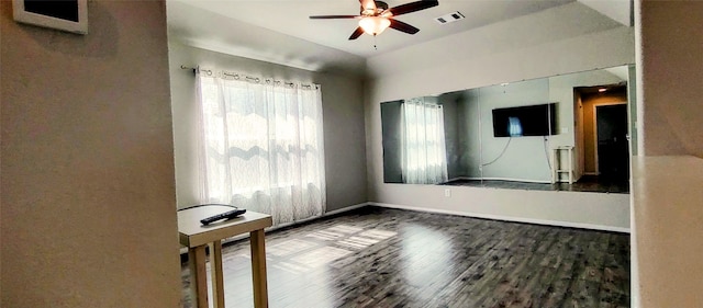 empty room with hardwood / wood-style flooring and ceiling fan