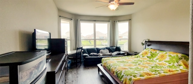 bedroom featuring ceiling fan and dark hardwood / wood-style flooring