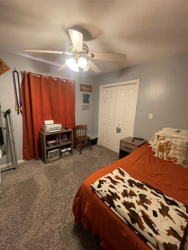 carpeted bedroom featuring a closet and ceiling fan