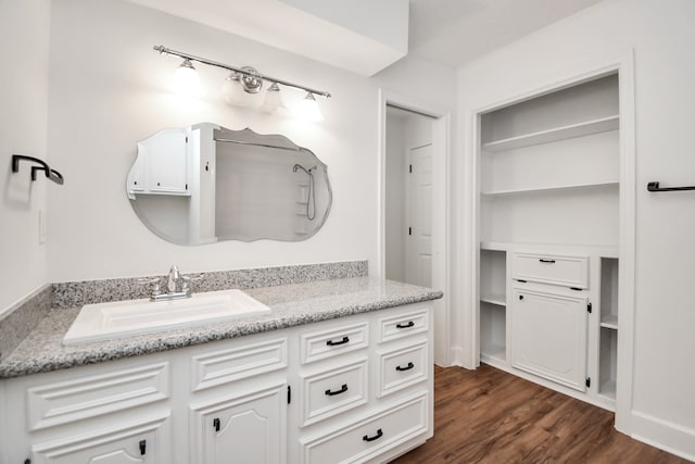 bathroom with vanity and hardwood / wood-style flooring