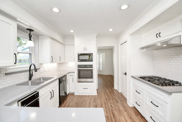 kitchen with white cabinets, sink, and black appliances