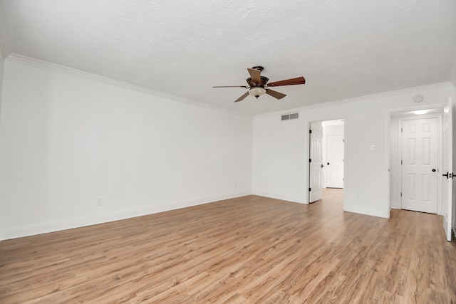 spare room featuring ceiling fan, ornamental molding, and light hardwood / wood-style flooring