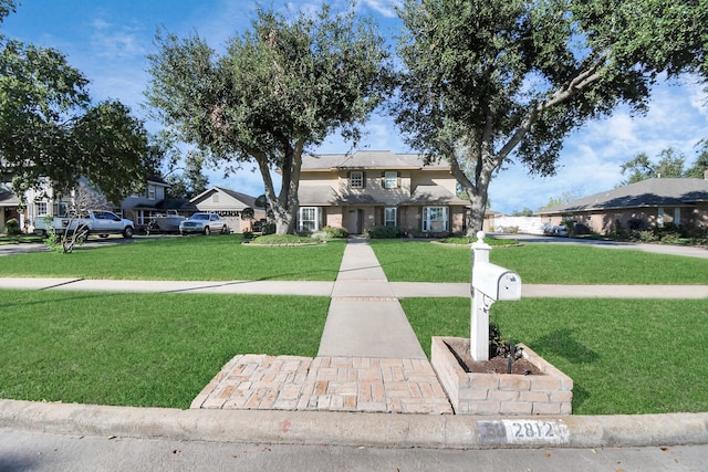 view of property featuring a front yard