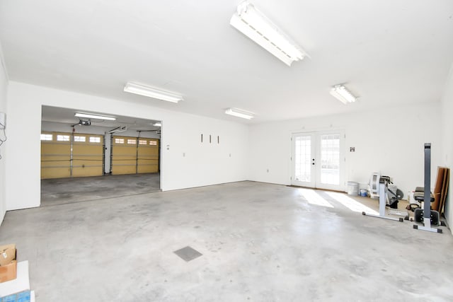 garage featuring a garage door opener and french doors