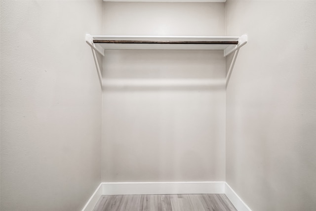 spacious closet featuring hardwood / wood-style flooring