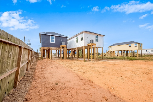 back of property featuring a carport