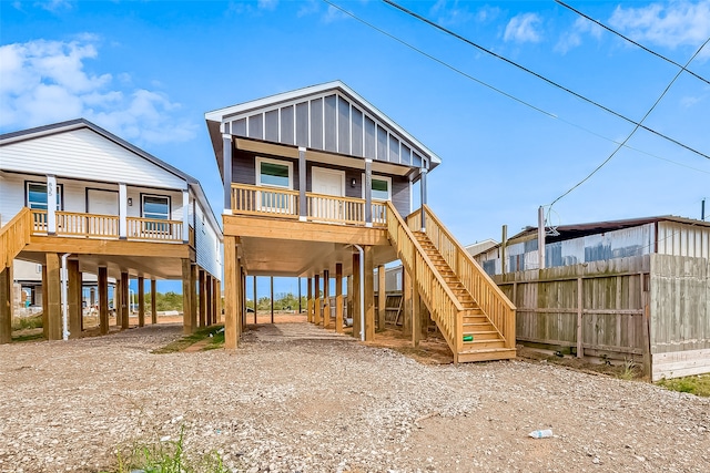 view of front of house with a carport and covered porch