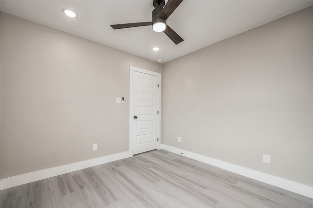 unfurnished room with ceiling fan and light hardwood / wood-style flooring