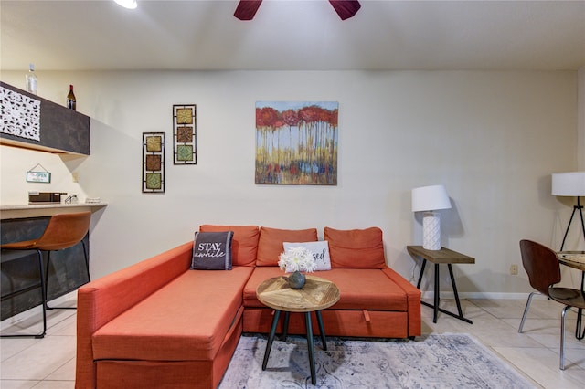 living room featuring ceiling fan and light tile patterned floors