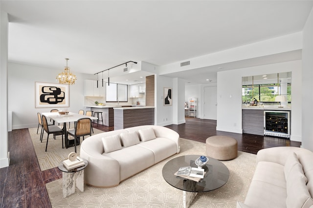 living room featuring wine cooler and light wood-type flooring