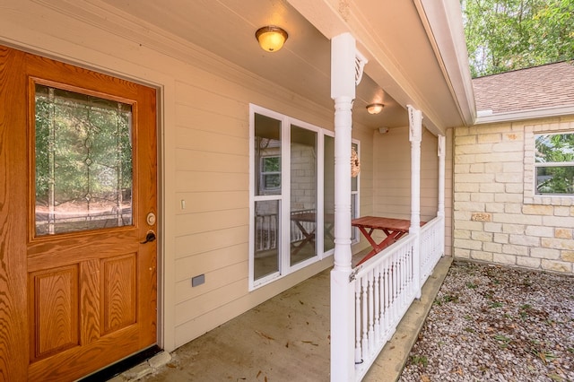 doorway to property with a porch