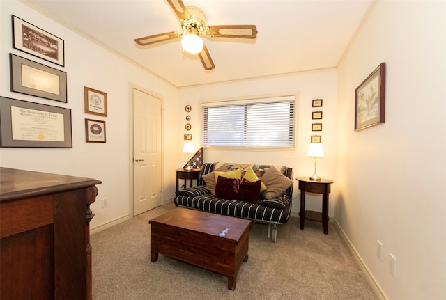 carpeted living room with ceiling fan