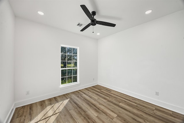 empty room with ceiling fan and light wood-type flooring